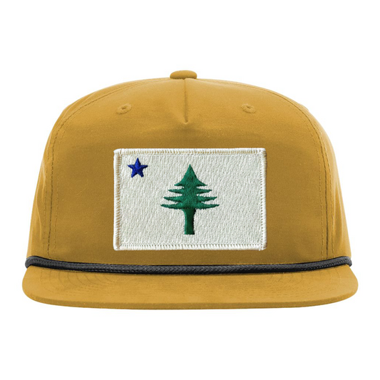 Yellow cap with embroidered design  from the 1901 Maine state flag on a white background