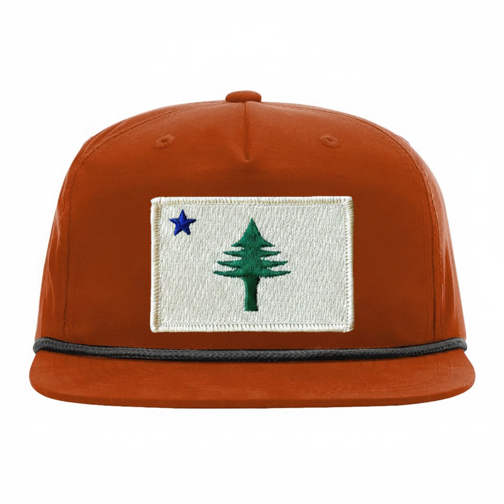 Dark orange cap with embroidered design from the 1901 Maine state flag  on a white background
