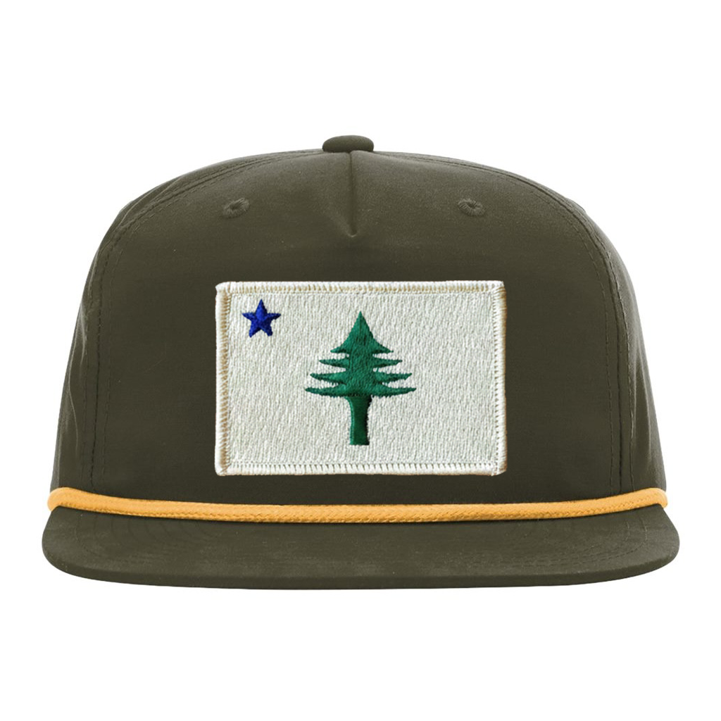 Green cap with embroidered design from the 1901 Maine state flag  on a white background