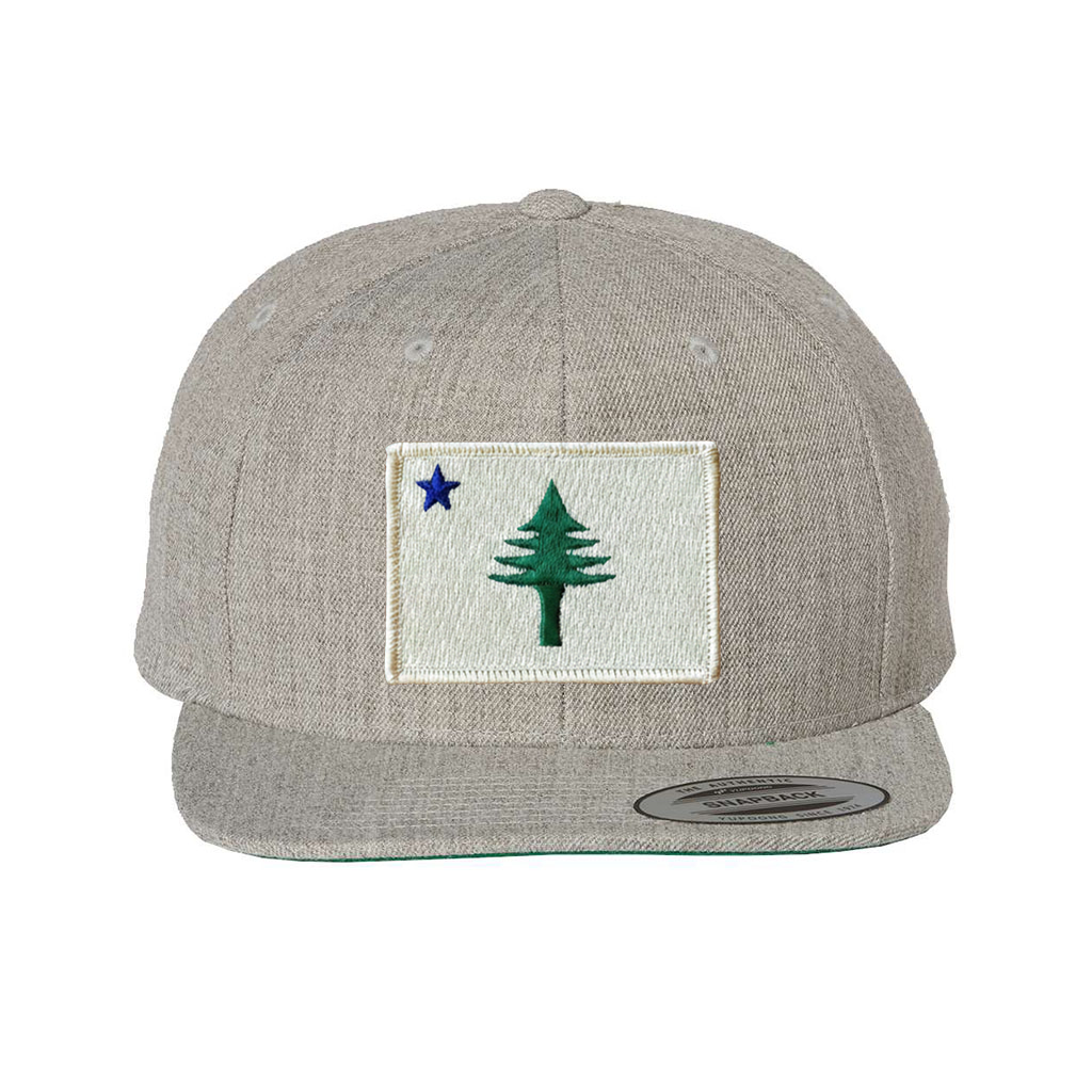 Gray cap with a patch featuring a star and a tree from the 1901 Maine state flag on a white background