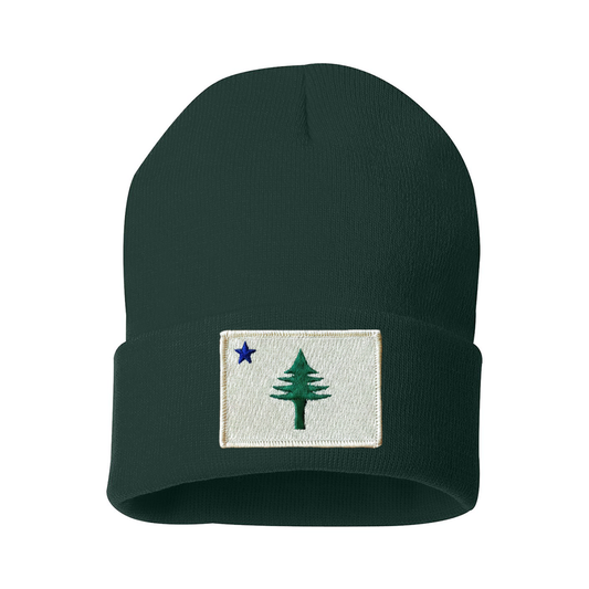 Dark green beanie with embroidered design from the 1901 Maine state flag  on a white background
